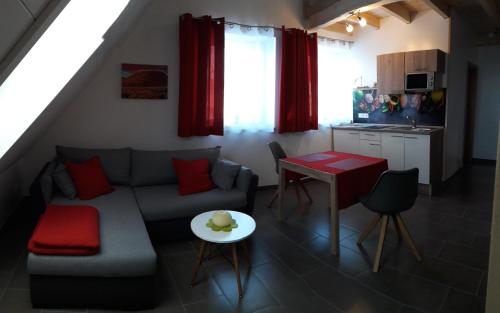 a living room with a couch and a table at Hotel Dietz in Bopfingen