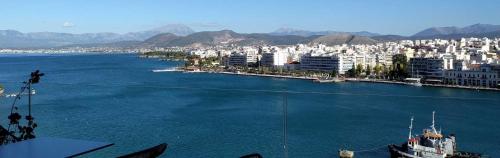 a large body of water with a city in the background at Hara Hotel in Chalkida