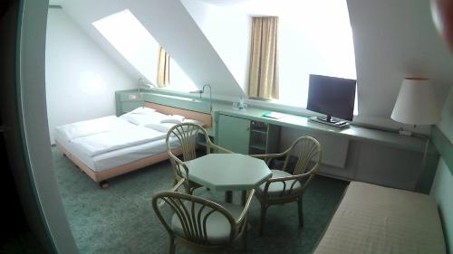 Voodi või voodid majutusasutuse Hotel Christinenhof garni - Bed & Breakfast toas