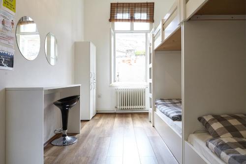 a small room with a bed and a window at Lovecroatia Zagreb - 'Pax nest' in Zagreb
