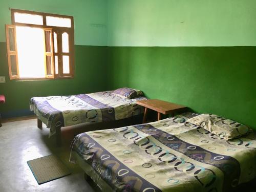 מיטה או מיטות בחדר ב-Ansari House