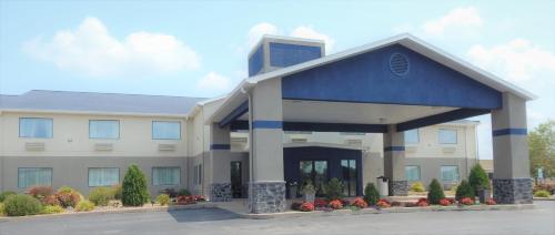 a large office building with a blue roof at Best Western Brookfield in Brookfield