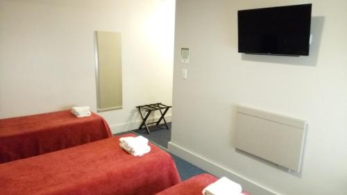 TV a/nebo společenská místnost v ubytování Estepa Hotel
