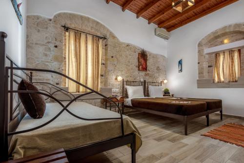 Postel nebo postele na pokoji v ubytování Cretan Villa Hotel