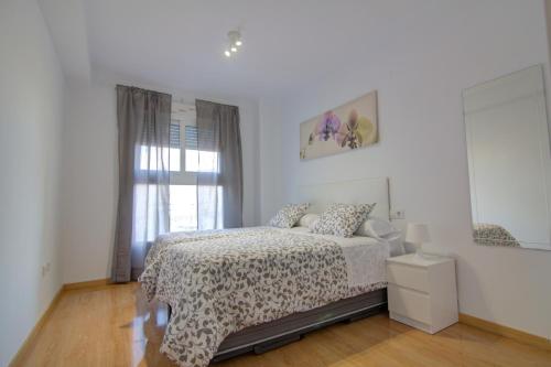 Postel nebo postele na pokoji v ubytování apartamento plaza san juan