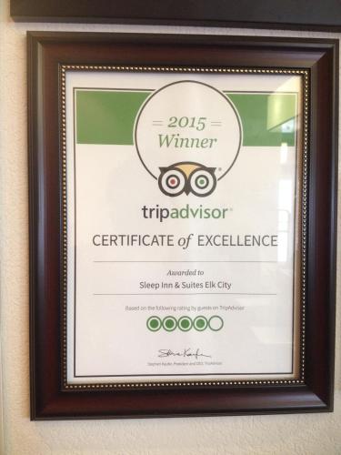 a framed certificate of excellence for a winter triadotechnology certificate of excellence at Sleep Inn & Suites Elk City in Elk City