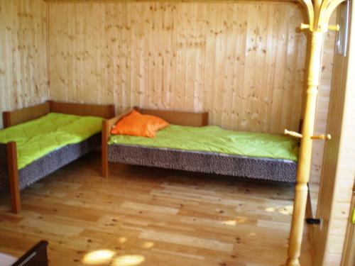 En eller flere senge i et værelse på Guest House Vītoli