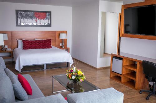 Postel nebo postele na pokoji v ubytování AMD Hotel