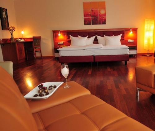 Ένα ή περισσότερα κρεβάτια σε δωμάτιο στο Hotel Santo