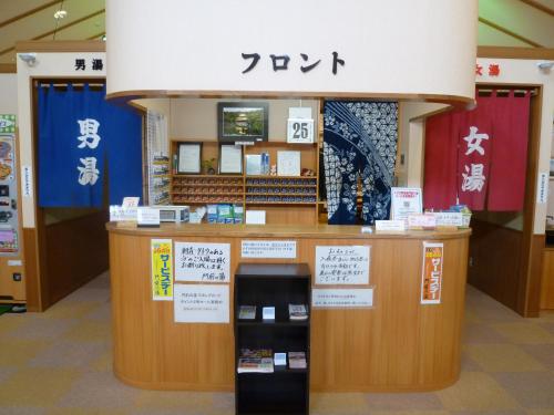 a store with a counter with signs on it at Hotel Monzennoyu in Joetsu