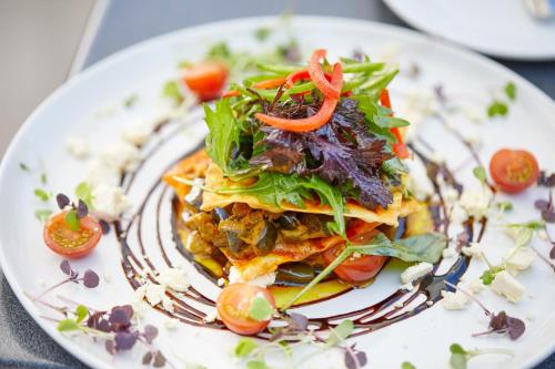 a plate of food with a salad on it at Commodore Airport Hotel Christchurch in Christchurch