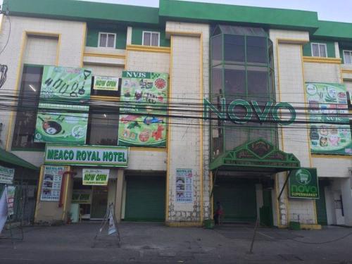 a building with signs on the side of it at Meaco Royal Hotel - Plaridel in Plaridel