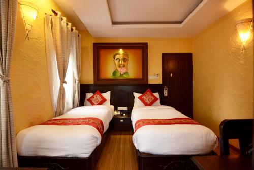 Postel nebo postele na pokoji v ubytování Kasthamandap Boutique Hotel