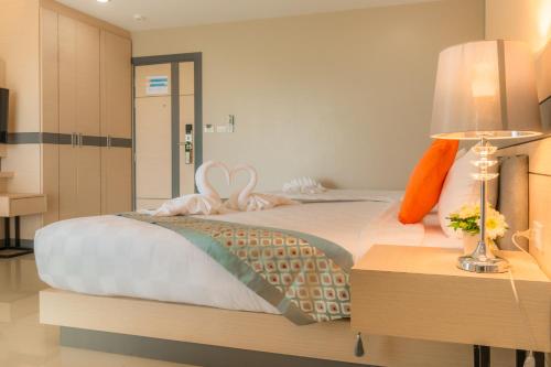 The Smart Hotel Hat Yaiにあるベッド
