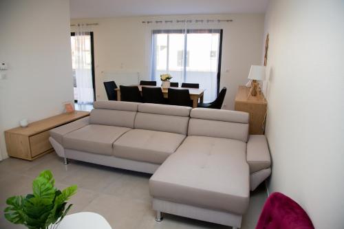 a living room with a couch and a table at Albipavillon in Albi