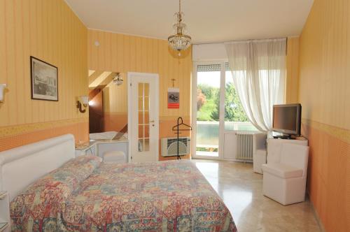 Postel nebo postele na pokoji v ubytování Hotel Fossati