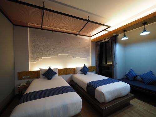 Ps Sriphu Hotelにあるベッド