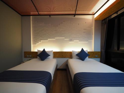 Ps Sriphu Hotelにあるベッド