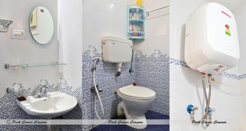 La salle de bains est pourvue de toilettes et d'un lavabo. dans l'établissement Park Corner Guesthouse, à Coonoor