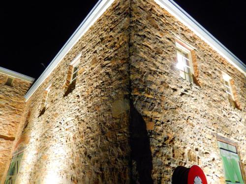a brick building with windows on the side of it at Morialta Barns in Norton Summit