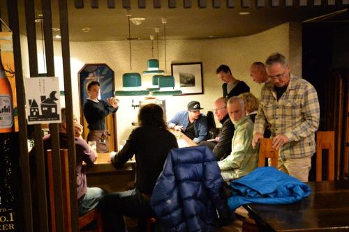 a group of people standing around a table in a room at Kogakuro in Myoko