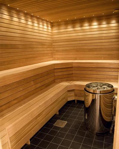 a sauna with a trash can in the middle at Best Western Royal Star in Stockholm
