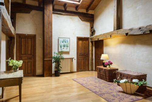 a large room with wooden floors and wooden ceilings at Hotel Akerreta in Akerreta