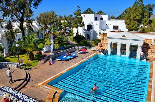 an overhead view of a large swimming pool with people in it at Caribbean Village Agador - All inclusive in Agadir