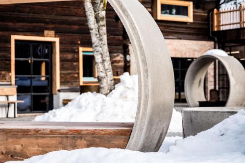 a sculpture in the snow in front of a building at Peakini Farmhaus in Untertauern