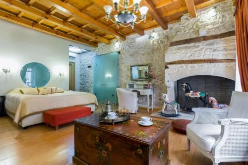 Кровать или кровати в номере Avli Lounge Apartments