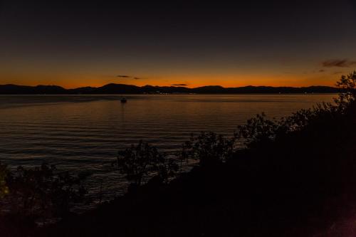 a sunset over a large body of water at Villa Euphoria Studio in Aegina, A' Marathonas Bay in Aegina Town