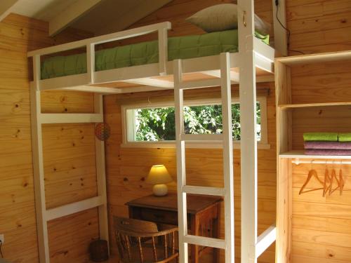 a bedroom with bunk beds in a cabin at Dodo House in Villa La Angostura