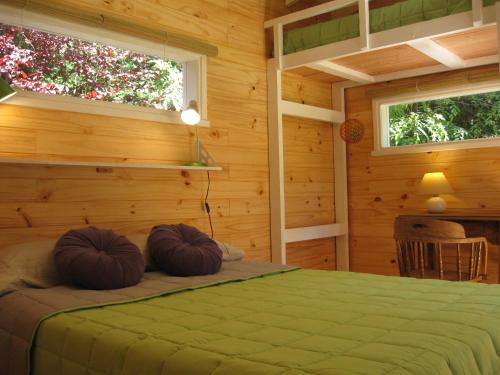 Postel nebo postele na pokoji v ubytování Dodo House
