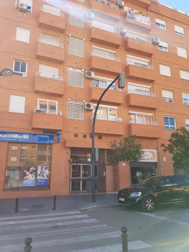 a car parked in front of a building at Apartamento Ciencias y Playa in Valencia