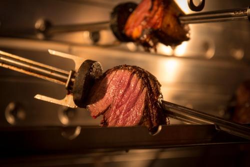 a piece of meat is being cooked in an oven at Mettner Hof in Metten
