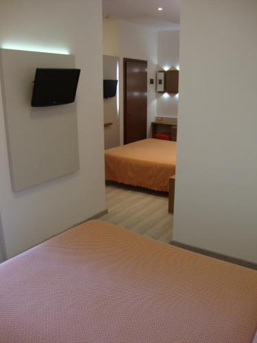 Postel nebo postele na pokoji v ubytování Hotel Venezia