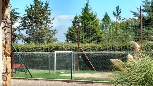 a batting cage with a net and a goal at Cabaña Loft La Ribera in Maipú