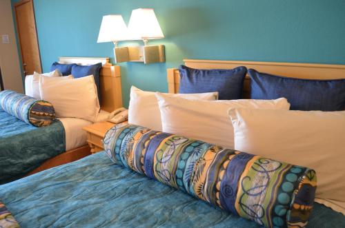 a hotel room with two beds with pillows at Sun Viking Lodge - Daytona Beach in Daytona Beach