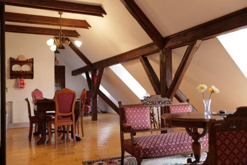 a dining room with a table and chairs at The Houses of History - anno 1830 in Tihany