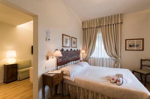 Ένα ή περισσότερα κρεβάτια σε δωμάτιο στο Hotel Garden