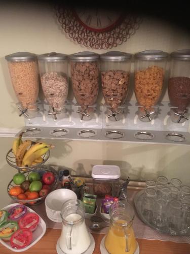 a refrigerator filled with bowls of cereal and other food at Abbey Court Guest House in Carlisle