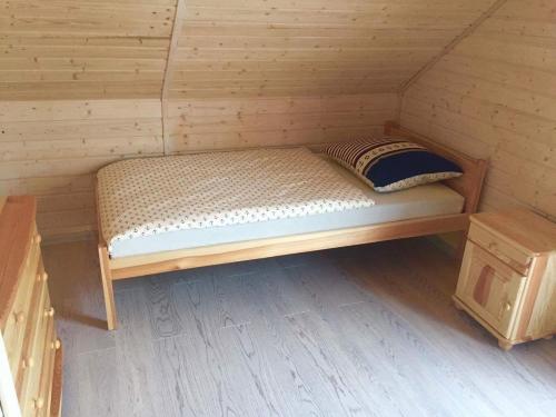 A bed or beds in a room at Domki VIP dla rodzin Ustka