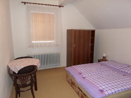 Кровать или кровати в номере Apartman Svoboda