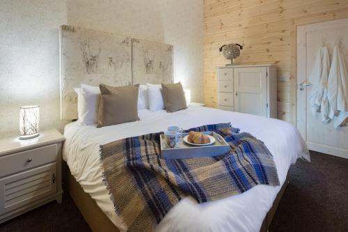 Ένα ή περισσότερα κρεβάτια σε δωμάτιο στο The Lodges at Artlegarth