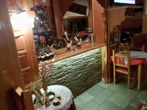 a bar in a room with a glass counter at Asteri Metsovou in Metsovo