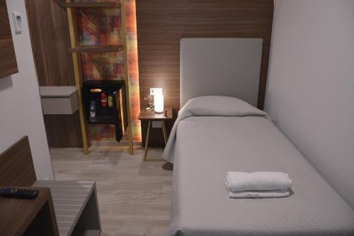 Letto o letti in una camera di 8room Hotel