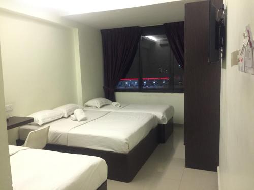 Ένα ή περισσότερα κρεβάτια σε δωμάτιο στο Desa house hotel