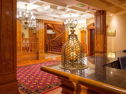 a lobby with a table with a vase on it at Lady Gregory Hotel, Leisure Club & Beauty Rooms in Gort
