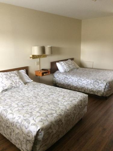 Postel nebo postele na pokoji v ubytování Dolan's Motel