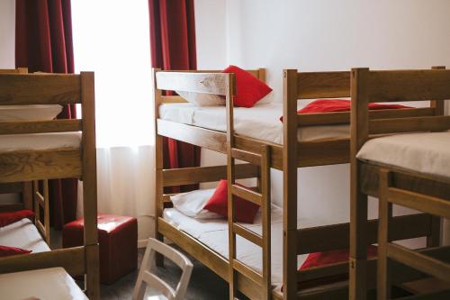 a group of bunk beds in a room at Hostel Globo in Šibenik